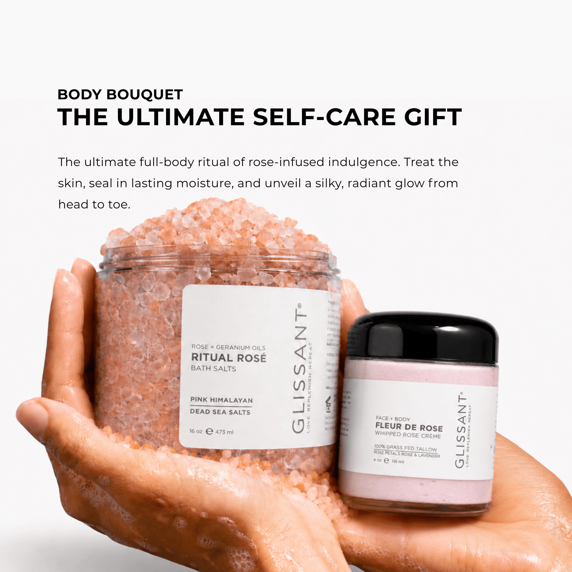 Two hands holding a large jar of pink Himalayan salt and a smaller jar of rose-infused body oil against a white background, with promotional text above reading 'BODY Bouquet THE ULTIMATE SELF-CARE GIFT.' Visible brand on both products is Glissant.