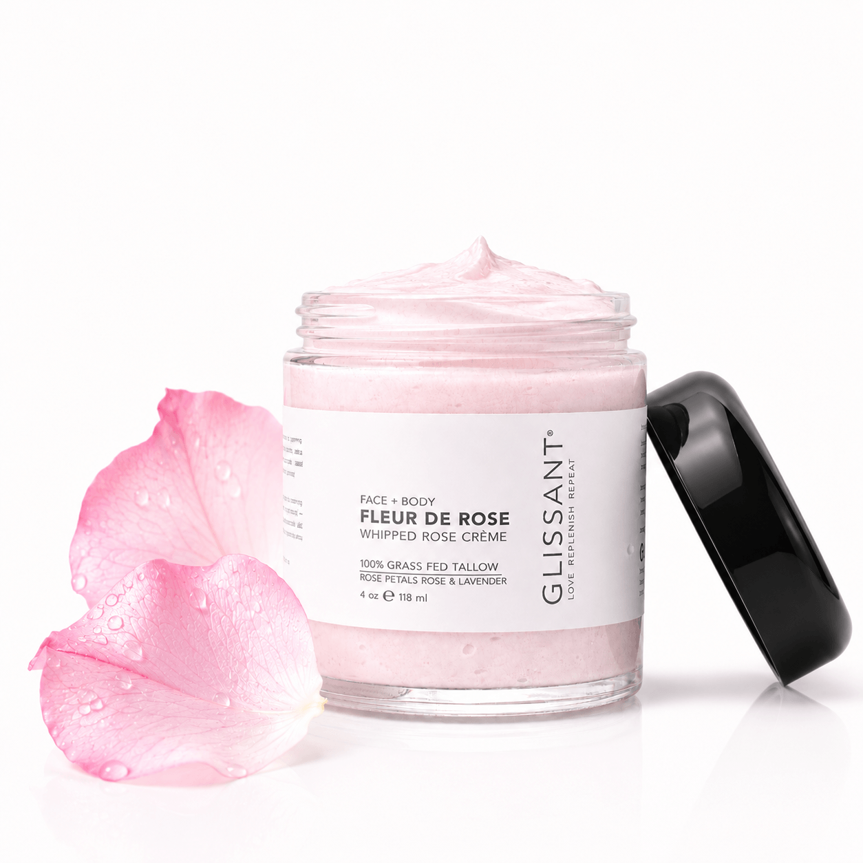 Jar of Glissant Fleur de Rose whipped rose crème with pink cream and petals on a white background