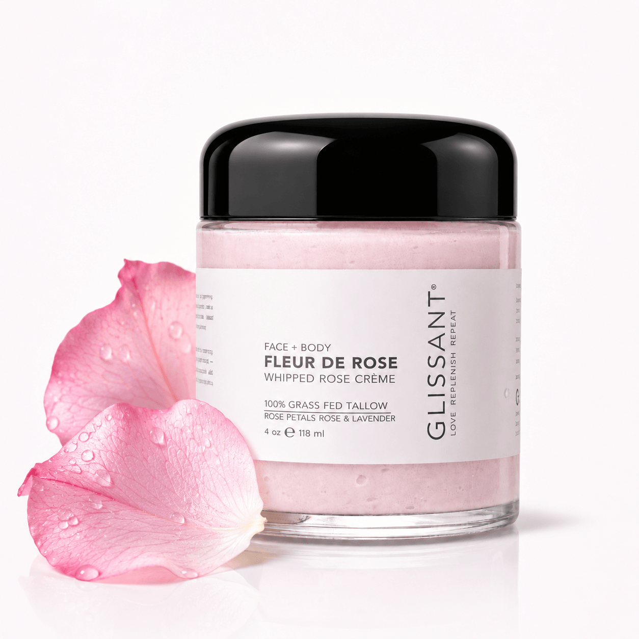 Jar of Fleur de Rose whipped rose crème with pink petals on a white background